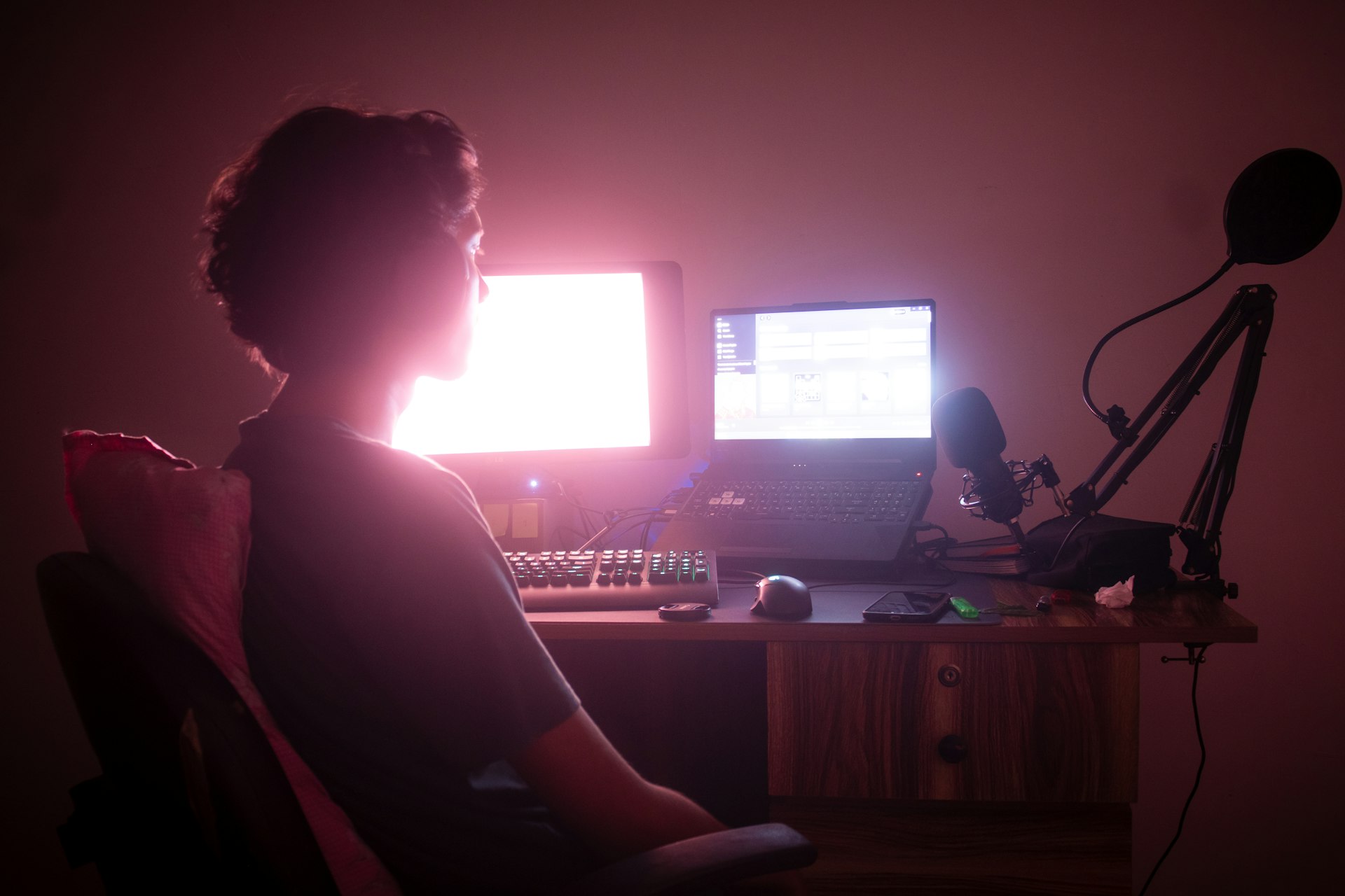 a person sitting in front of a computer